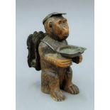 A late 19th/early 20th century Blackforest carved wooden monkey smokers compendium. 18 cm high.