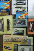 A collection of various boxed die cast vehicles including Dinky.