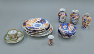 A collection of Imari porcelain and a Canton cup and saucer. The largest 13 cm high.