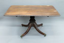 A Georgian mahogany Chippendale style tilt top breakfast table. 143 cm long.
