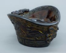 A libation cup. 7.5 cm high.