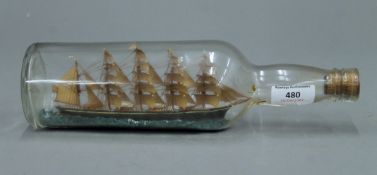 A five masted schooner in a bottle. 29.5 cm long.