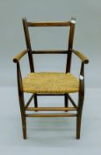 An early 20th century child's chair. 35 cm wide.