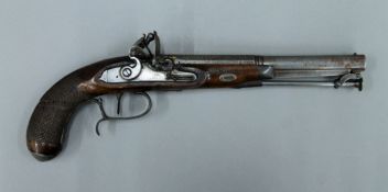 A flintlock pistol. 35 cm long.