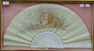 A 19th century satin fan in a later boxed frame. 33 x 60 cm.