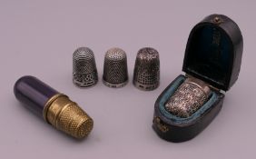 Four silver thimbles, etc.