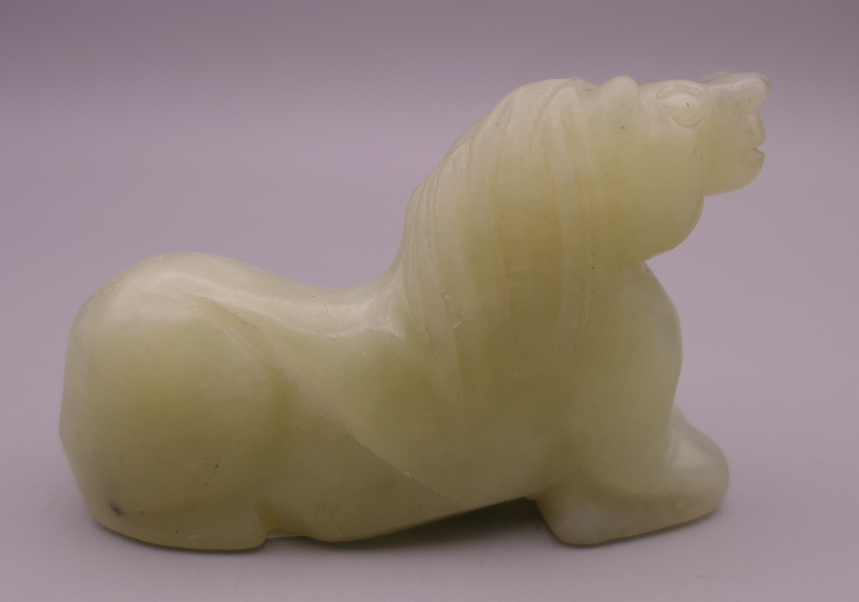 A Chinese pale green jade horse. 7.5 cm long. - Image 2 of 4