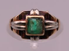 A Continental 18 ct gold solitaire emerald dress ring. Ring size F. 4.1 grammes total weight.