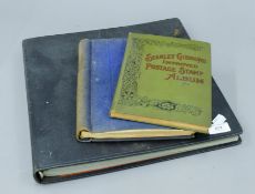 Two stamp albums and a postcard album.