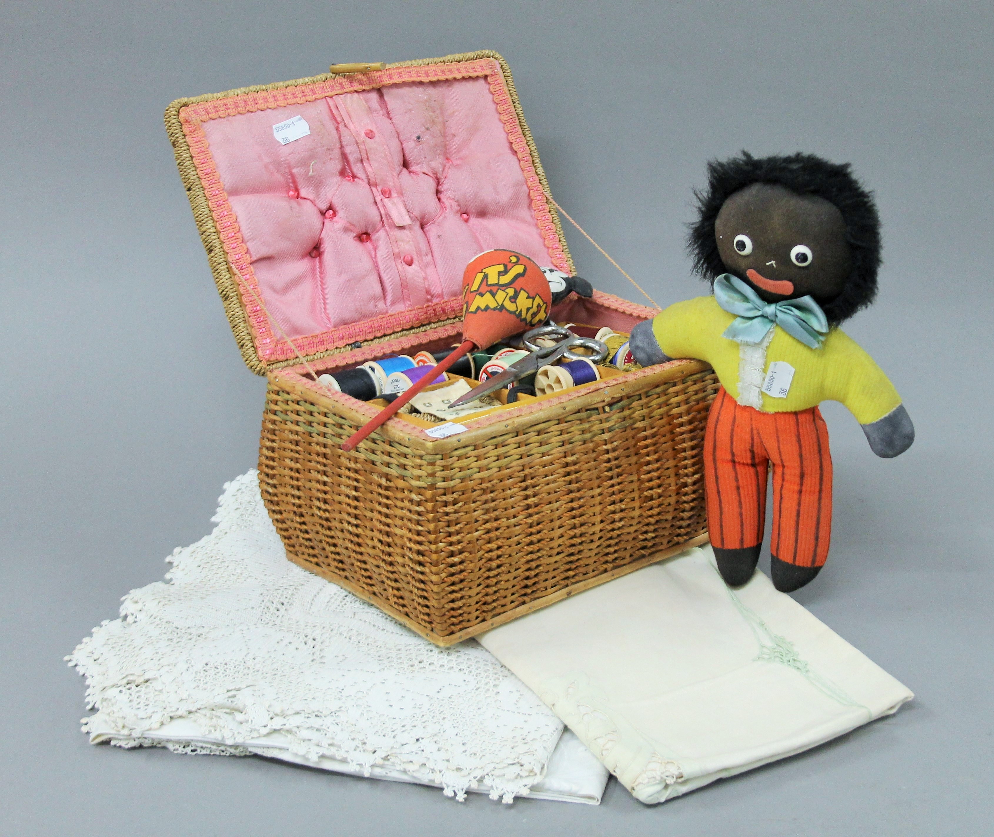 A vintage sewing box, a Mickey Mouse toy, a Golly and a small quantity of linen.