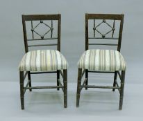 A pair of 19th century faux bamboo chairs. 44 cm wide.