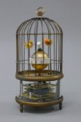 A bird cage clock. 19 cm high.