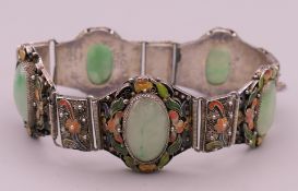 A vintage Chinese jade and enamelled silver bracelet. Approximately 18 cm long.
