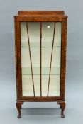 An early 20th century walnut display cabinet. 58 cm wide.