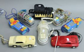 A quantity of various novelty telephones.