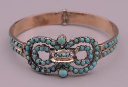 A Victorian turquoise set bangle form bracelet. 6.5 cm wide.