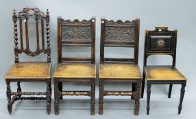 A pair of Victorian carved oak chairs and two others.
