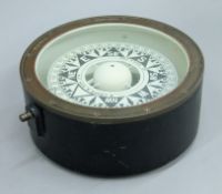 An early 20th century ships compass by B Cooke and Son, Hull. 23 cm diameter.