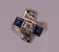 An Art Deco style 14 ct gold diamond and sapphire ring. Ring size H. 4.2 grammes total weight.