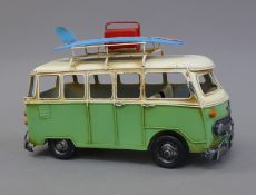 A tin plate model of a scooter and VW camper. The former 29 cm long.