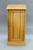 A Victorian satin walnut pot cupboard. 37 cm wide.