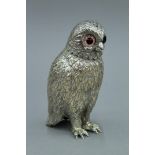 A silver plated owl form castor. 13 cm high.