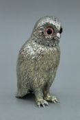 A silver plated owl form castor. 13 cm high.