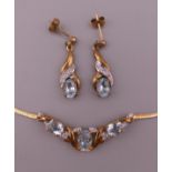 A 9 ct gold diamond and aquamarine set necklace,