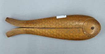 A wooden fish form nutcracker. 21 cm long.