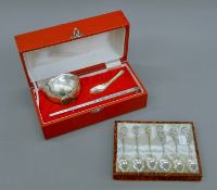 A cased Chinese plated rice set and a set of six plated tea spoons.