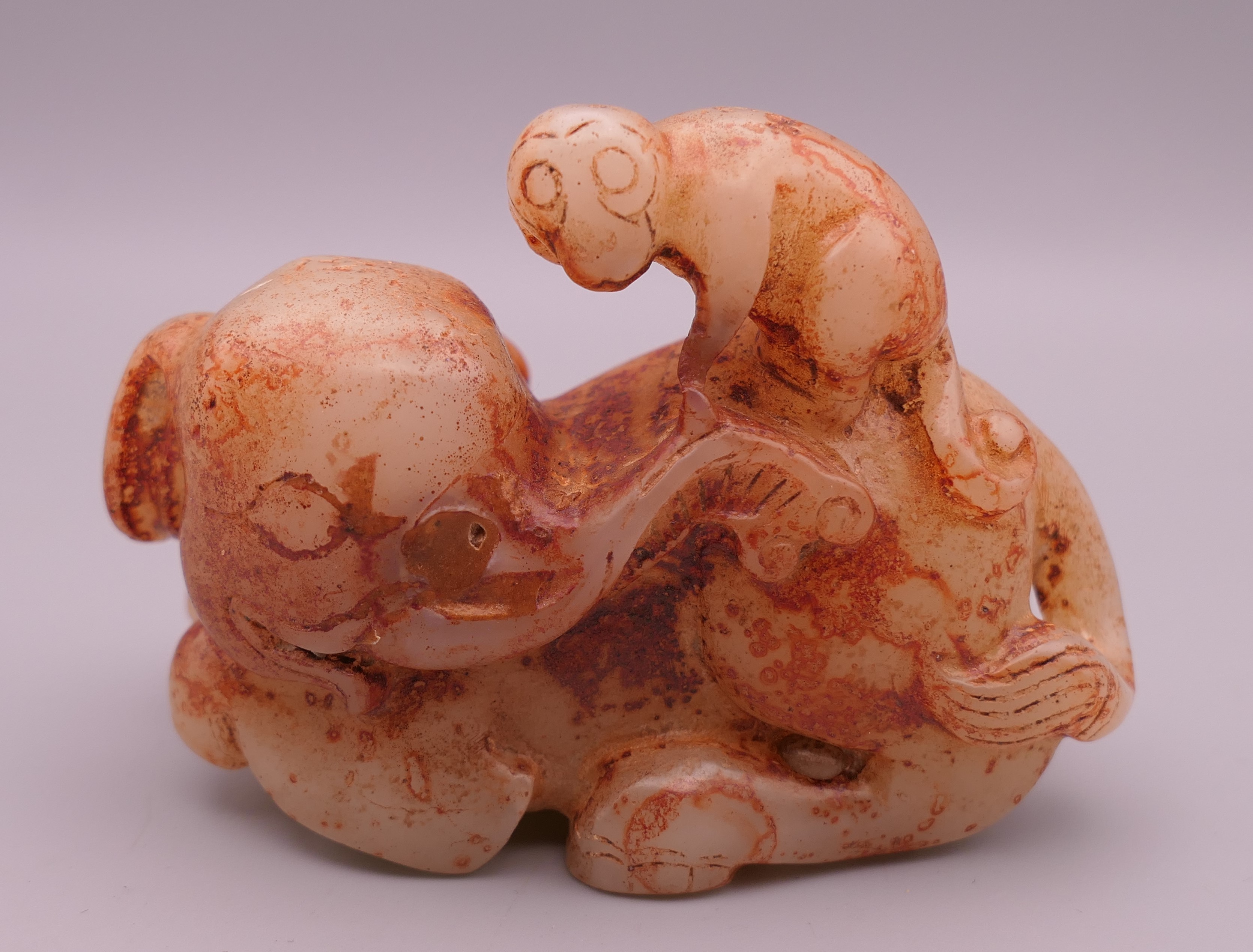 A jade elephant and monkey. 9 cm long.