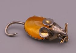 A silver dress brooch formed as a mouse. 4 cm long.