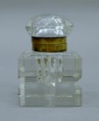 A cut glass inkwell. 10 cm high.