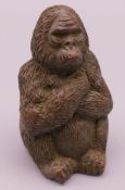 A bronze model of a gorilla. 5 cm high.
