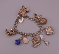 A silver charm bracelet. 61.1 grammes total weight.