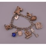 A silver charm bracelet. 61.1 grammes total weight.