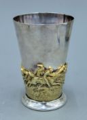 A Victorian Pryor Tyzack and Co silver plated and gilt beaker decorated with a horse racing scene.