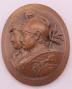 A cameo type brooch. 5.5 cm high.