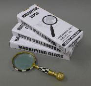 Three magnifying glasses.