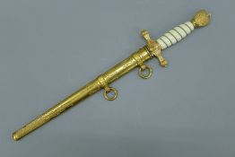 A German Ceremonial Naval dagger in scabbard. 42 cm long overall.