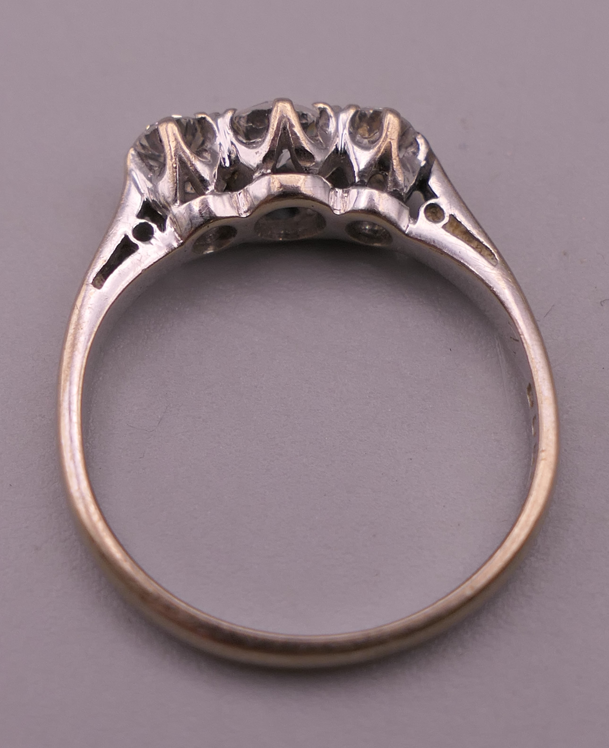 An 18 ct white gold three stone diamond ring. Ring size K/L. 2.5 grammes total weight. - Image 3 of 6