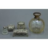 A silver topped glass scent bottle,