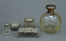 A silver topped glass scent bottle,