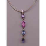 A silver necklace with gem set pendant. The pendant 4.5 cm high.