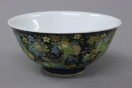 A Chinese black ground porcelain bowl. 16 cm diameter.