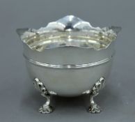 A small silver four footed bowl, hallmarked for Sheffield 1900. 7 cm high. 4.8 troy ounces.