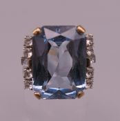 A 10 K gold and aquamarine ring. Ring size M. 7.9 grammes total weight.