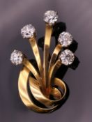 An unmarked gold and diamond spray brooch, set with five diamonds, each stone spreading between .