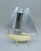 A vintage boat form heater. 53 cm high.