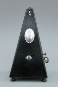 A vintage metronome. 23 cm high.